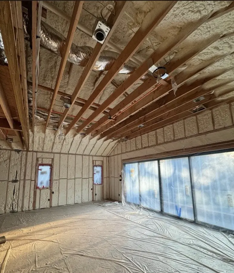 Interior walls and ceiling insulated with spray foam during new construction in North Bend